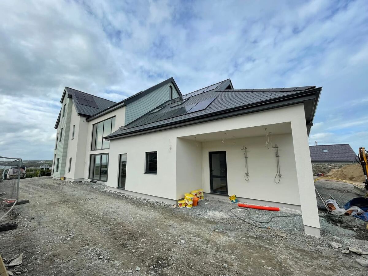 Large modern house finished in white render