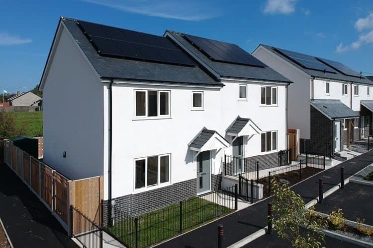 Pair of new-build semi-detached houses in white render