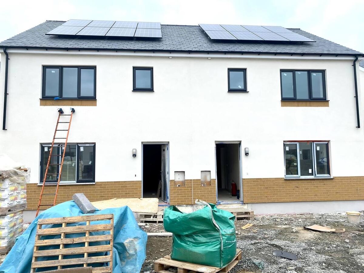 Terrace of new houses with render going on